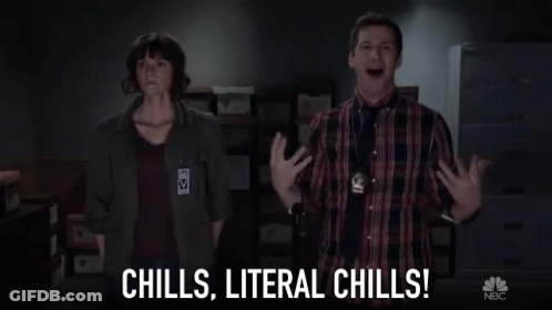 A Man And A Woman Are Standing Next To Each Other In A Room With The Words `` Chills , Literal Chills '' . GIF