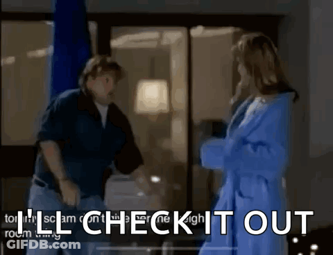A Man And A Woman Are Standing Next To Each Other In A Room With The Words I 'Ll Check It Out . GIF