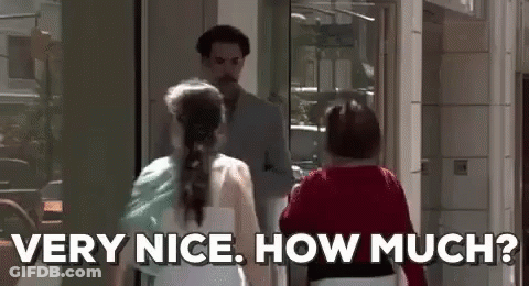 A Man And A Woman Are Standing Next To Each Other In Front Of A Building . The Woman Is Asking The Man How Much . GIF