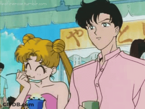 A Man And A Woman Are Standing Next To Each Other In Front Of A Sign That Says " Redfirerose Tumblr.com " On It GIF