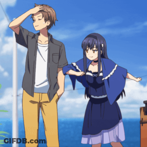 A Man And A Woman Are Standing Next To Each Other In Front Of The Ocean GIF
