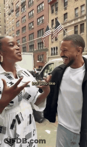 A Man And A Woman Are Standing Next To Each Other On A Street And The Woman Says But Also Like GIF