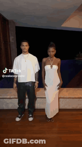 Man And Woman Standing Next To Each Other GIF