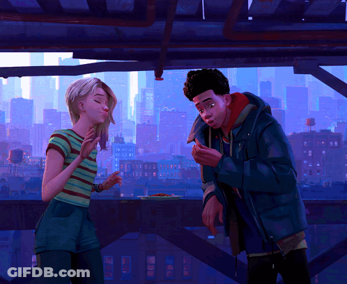 A Man And A Woman Are Standing Next To Each Other With A City Skyline In The Background GIF