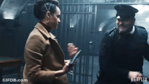 A Man And A Woman Are Standing Next To Each Other With A Netflix Logo On The Bottom GIF