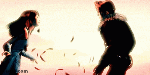 A Man And A Woman Are Standing Next To Each Other With Feathers Flying Around Them GIF