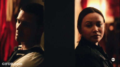 A Man And A Woman Are Standing Next To Each Other With The Abc Logo On The Bottom GIF