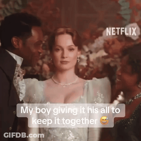 A Man And A Woman Are Standing Next To Each Other With The Caption " My Boy Giving It His All To Keep It Together GIF