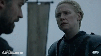 A Man And A Woman Are Standing Next To Each Other With The Word Got Written On The Bottom GIF