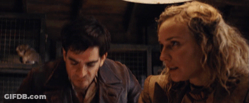 A Man And A Woman Are Standing Next To Each Other With The Words " F * Ck A Duck " Written In Yellow GIF