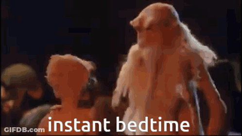 A Man And A Woman Are Standing Next To Each Other With The Words Instant Bedtime Written On The Screen . GIF