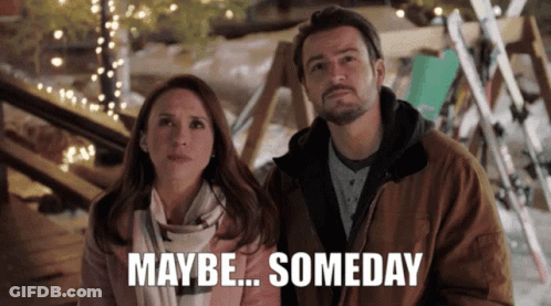 A Man And A Woman Are Standing Next To Each Other With The Words Maybe Someday Written Below Them GIF