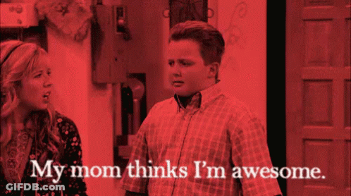 A Man And A Woman Are Standing Next To Each Other With The Words My Mom Thinks I 'M Awesome GIF