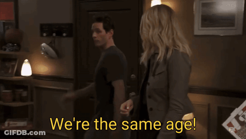 Man And Woman Standing Next To Each Other GIF