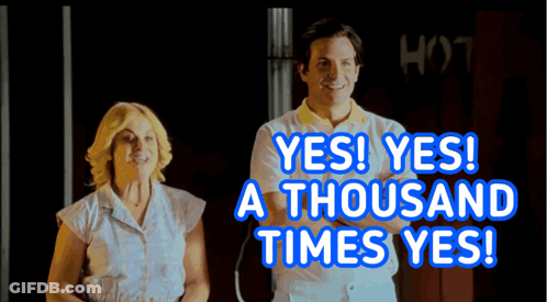 A Man And A Woman Are Standing Next To Each Other With The Words Yes Yes A Thousand Times Yes Behind Them GIF