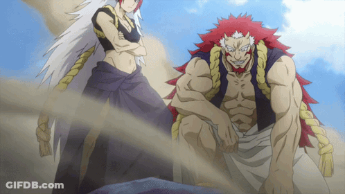 A Man And A Woman Are Standing Next To Each Other With Their Arms Crossed GIF