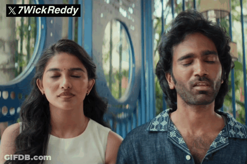 A Man And A Woman Are Standing Next To Each Other With Their Eyes Closed And A 7Wick Reddy Logo In The Corner GIF