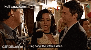 A Man And A Woman Are Talking In A Bar And The Man Says Ding Dong GIF