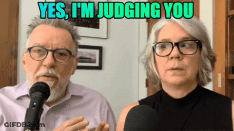 A Man And A Woman Are Talking Into Microphones With A Caption That Says Yes I 'M Judging You GIF
