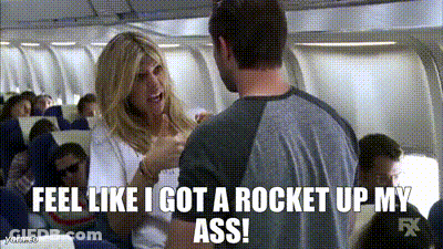 A Man And A Woman Are Talking On An Airplane And The Woman Is Saying " Feel Like I Got A Rocket Up My Ass " GIF