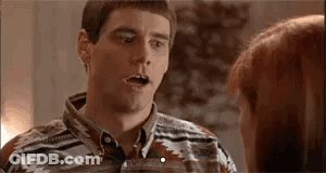 A Man And A Woman Are Talking To Each Other And The Man Is Making A Surprised Face . GIF