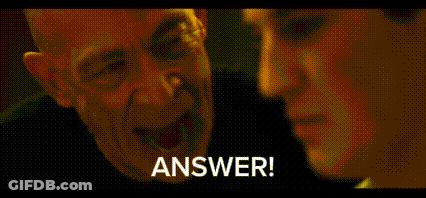 A Man And A Woman Are Talking To Each Other And The Man Is Saying `` Answer ! '' GIF