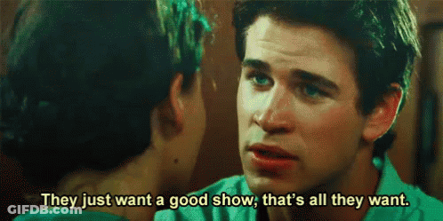A Man And A Woman Are Talking To Each Other And The Man Is Saying They Just Want A Good Show . GIF