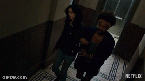 A Man And A Woman Are Walking Down A Hallway And The Word Sobriety Blows Is On The Bottom GIF