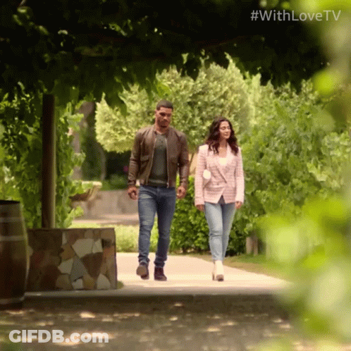 A Man And A Woman Are Walking Down A Path With The Hashtag #Withlovetv On The Bottom GIF