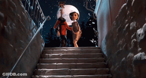 A Man And A Woman Are Walking Down A Set Of Stairs GIF