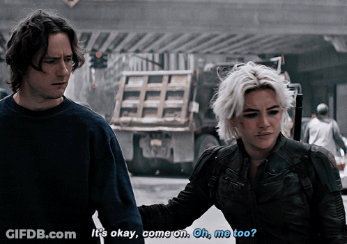 A Man And A Woman Are Walking Down A Street And The Man Says It 'S Okay Come On Oh Me Too GIF