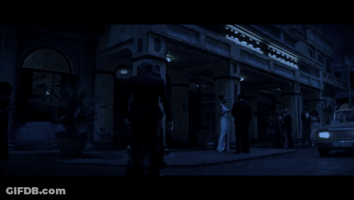 A Man And A Woman Are Walking In The Dark GIF