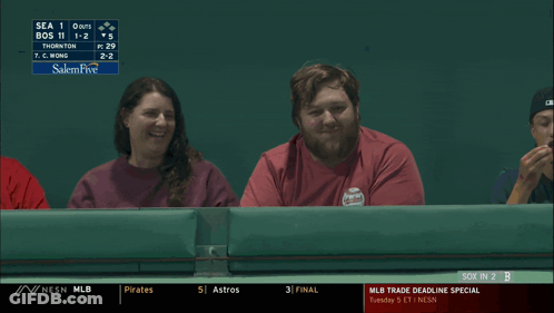 A Man And A Woman Are Watching A Baseball Game And The Man Is Saying Darn It GIF
