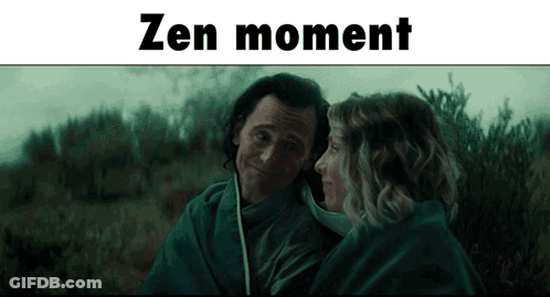 A Man And A Woman Are Wrapped In A Blanket And The Words Zen Moment Are Above Them GIF