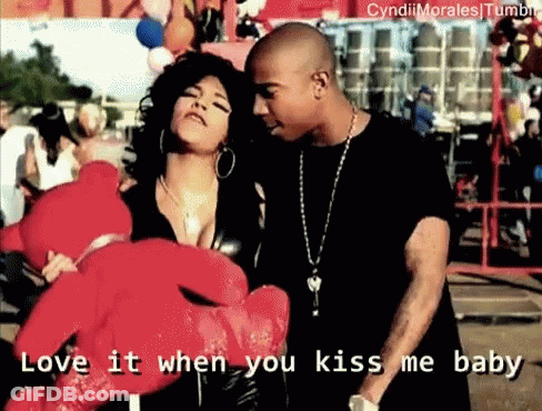 A Man And A Woman Holding A Teddy Bear With The Words Love It When You Kiss Me Baby Written Below Them GIF