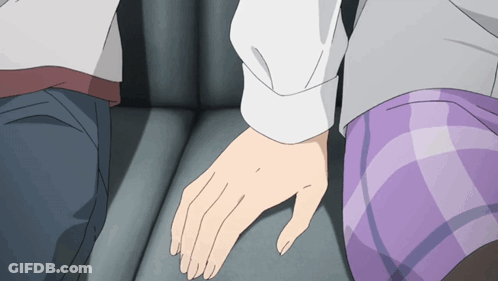 A Man And A Woman Holding Hands In A Car GIF