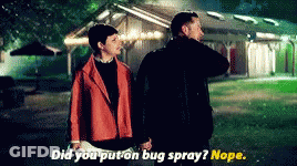 A Man And A Woman Holding Hands In Front Of A House With The Words Did You Put On Bug Spray ? Nope . GIF