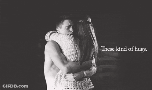 A Man And A Woman Hugging With The Words These Kind Of Hugs GIF