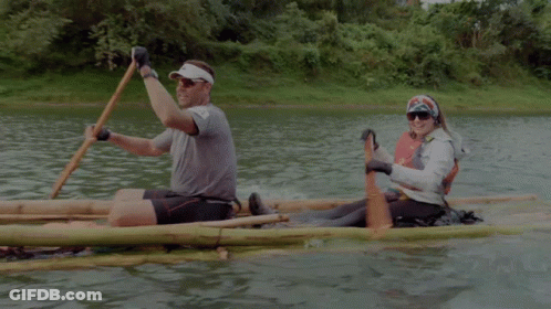 A Man And A Woman In A Raft With The Number 44 On Their Shirts GIF