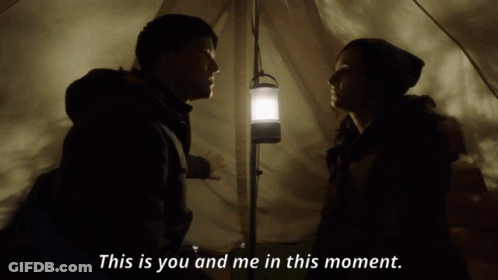 A Man And A Woman In A Tent With The Words This Is You And Me In This Moment Below Them GIF