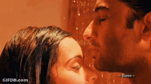 A Man And A Woman Kissing In A Shower With Toree Written On The Bottom Right GIF