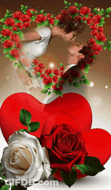 A Man And A Woman Kissing In Front Of A Heart Surrounded By Roses GIF