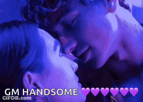 A Man And A Woman Kissing With The Words Gm Handsome Written Above Them GIF