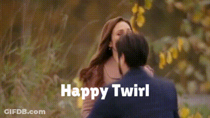 A Man And A Woman Kissing With The Words Happy Twirl Written On The Bottom GIF