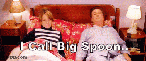 A Man And A Woman Laying In Bed With The Words " I Call Big Spoon " Written Above Them GIF