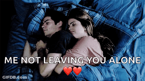 A Man And A Woman Laying In Bed With The Words Me Not Leaving You Alone GIF