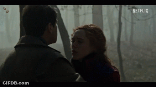 A Man And A Woman Looking At Each Other With A Netflix Logo In The Corner GIF
