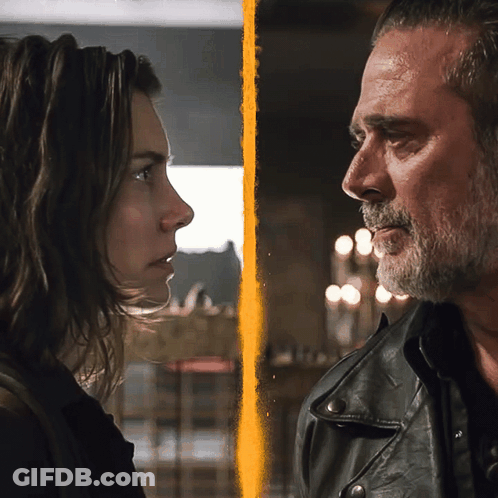 A Man And A Woman Looking At Each Other With A Yellow Stripe Between Them GIF