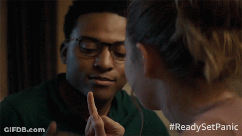 A Man And A Woman Looking At Each Other With #Readysetpanic Written On The Bottom GIF