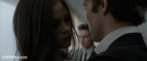 A Man And A Woman Looking Into Each Other 'S Eyes GIF
